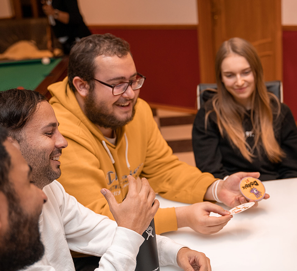 Group of Cumorah Academy alumni and students smiling during an educational community event